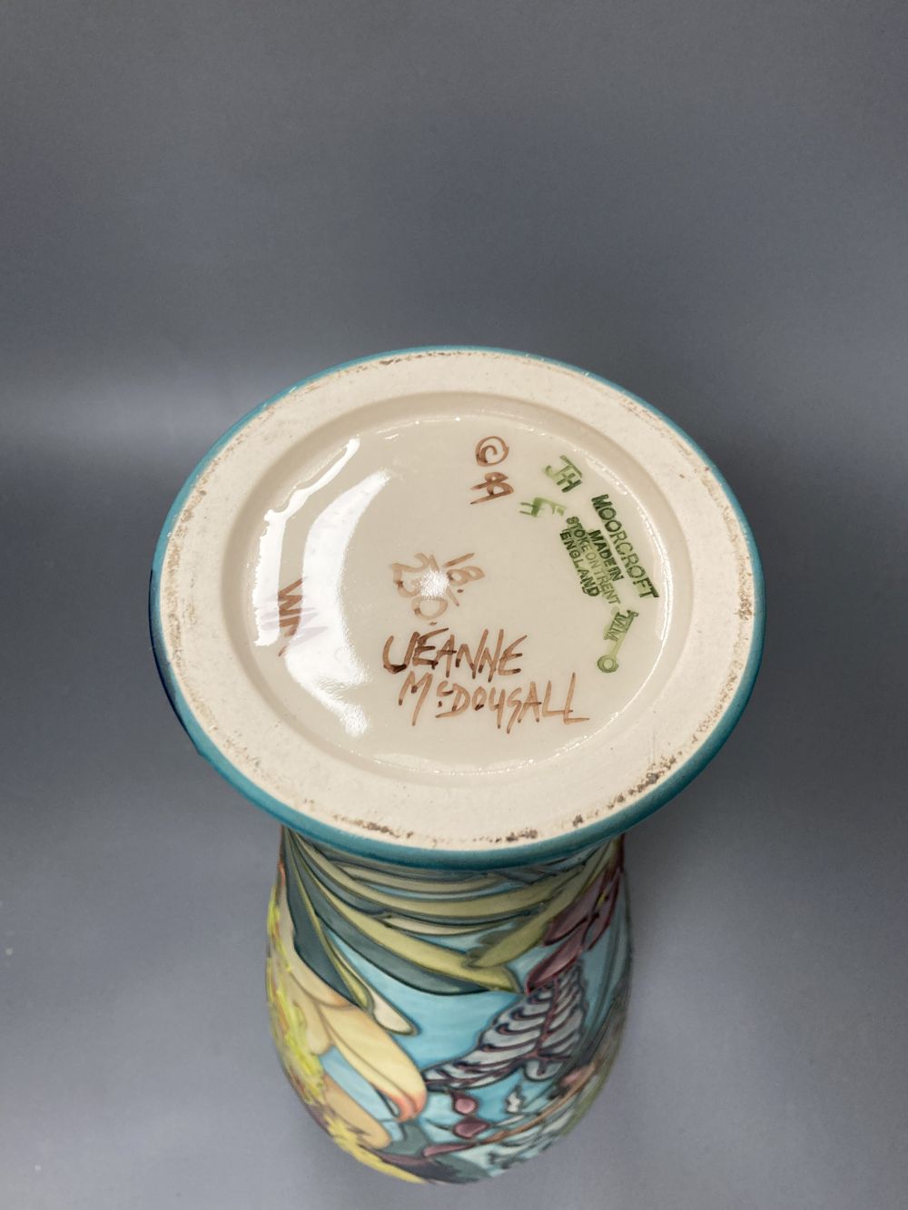 A Moorcroft vase, Jaraqui pattern, designed by Jeanne McDougall, limited edition number 18 of 250, height 37cm, together with origi